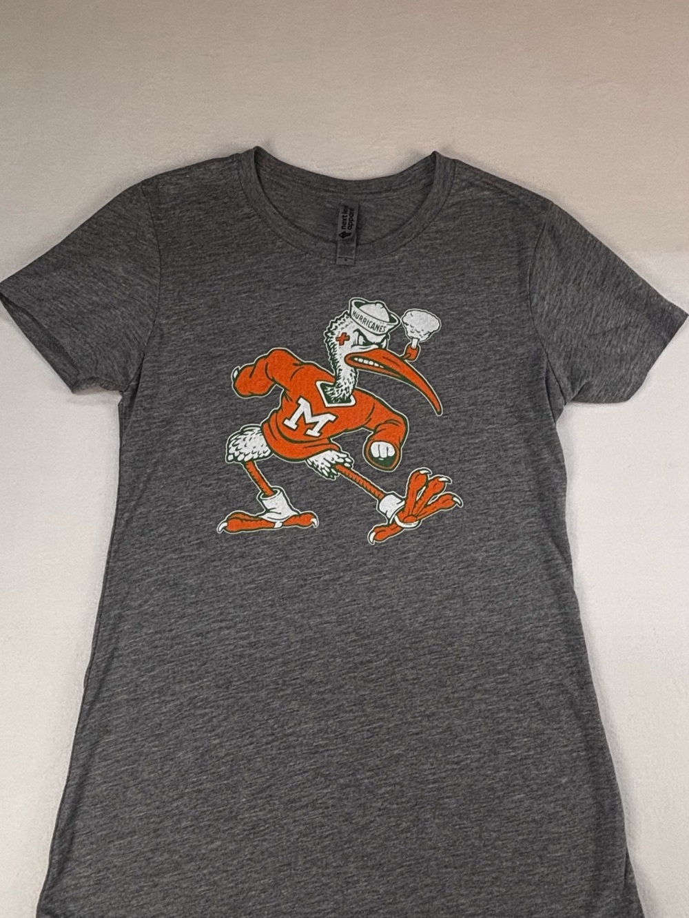 Next Level Apparel Women's Gray Miami Hurricanes Graphic Tee with Orange Mascot